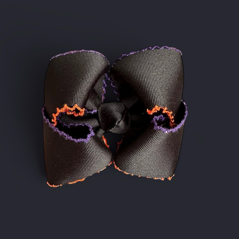 Black smocked bow with purple and orange accents